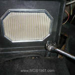 Removing bolts in front of the MG center console